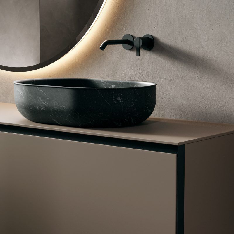 Luxury spa-style bathroom with ambient lighting and decor