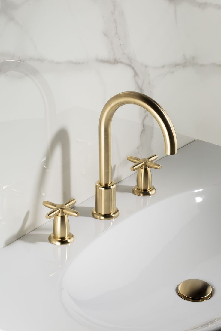 Gold finish faucet with elegant curved spout design